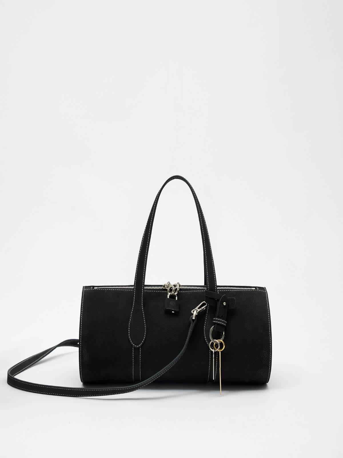 Black handbag with gold accents on a white background
